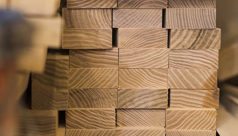 Stacked wooden timber construction material