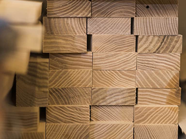 Stacked wooden timber construction material